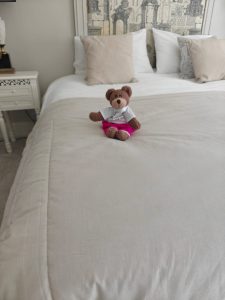 Tedwina on the bed in the house