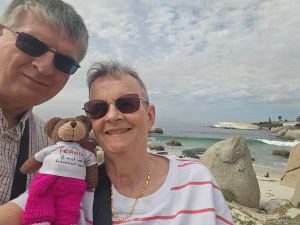 A family picture. There are penguins in the distance