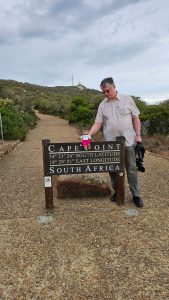 Dad helping me balance on the Cape Point sign