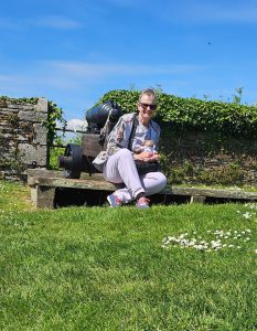 Mum and Tedwina in front of a cannon. 