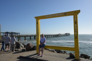 Tedwina with mum in front of a large Swakopmund sign